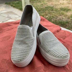 Brand: Sketchers. Color: Silver. Size: 6.5